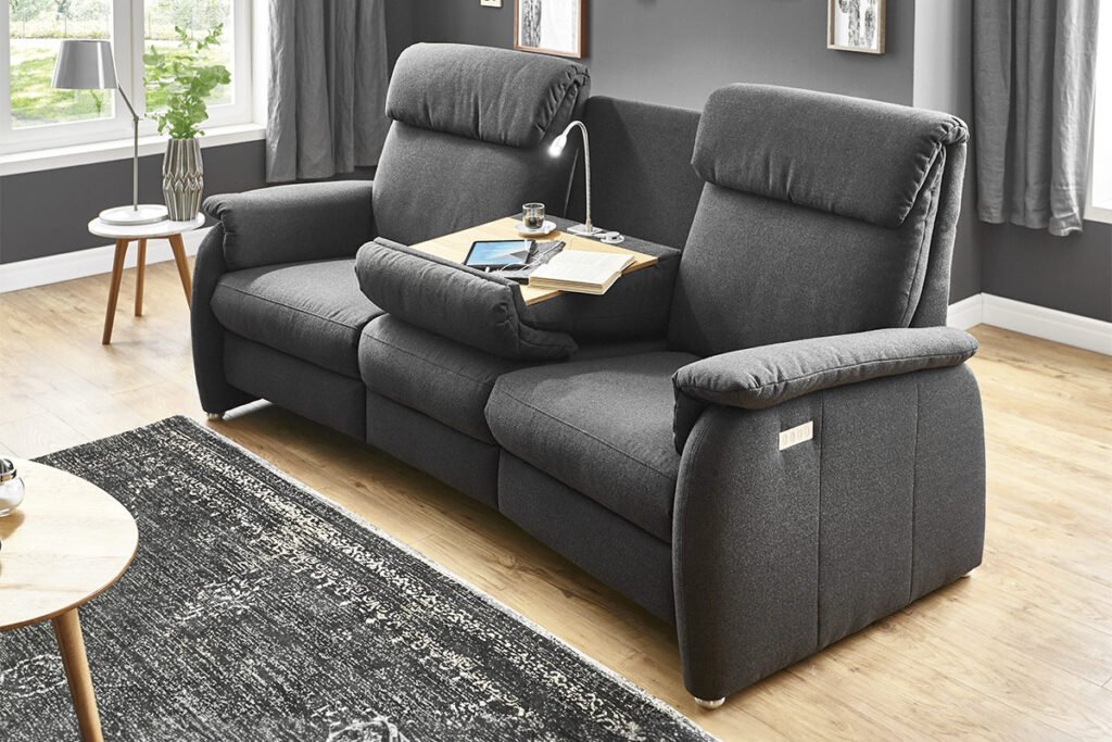 Trapezsofa, Bezug Stoff Dunkelgrau mit klappbarem Tisch und Leuchte