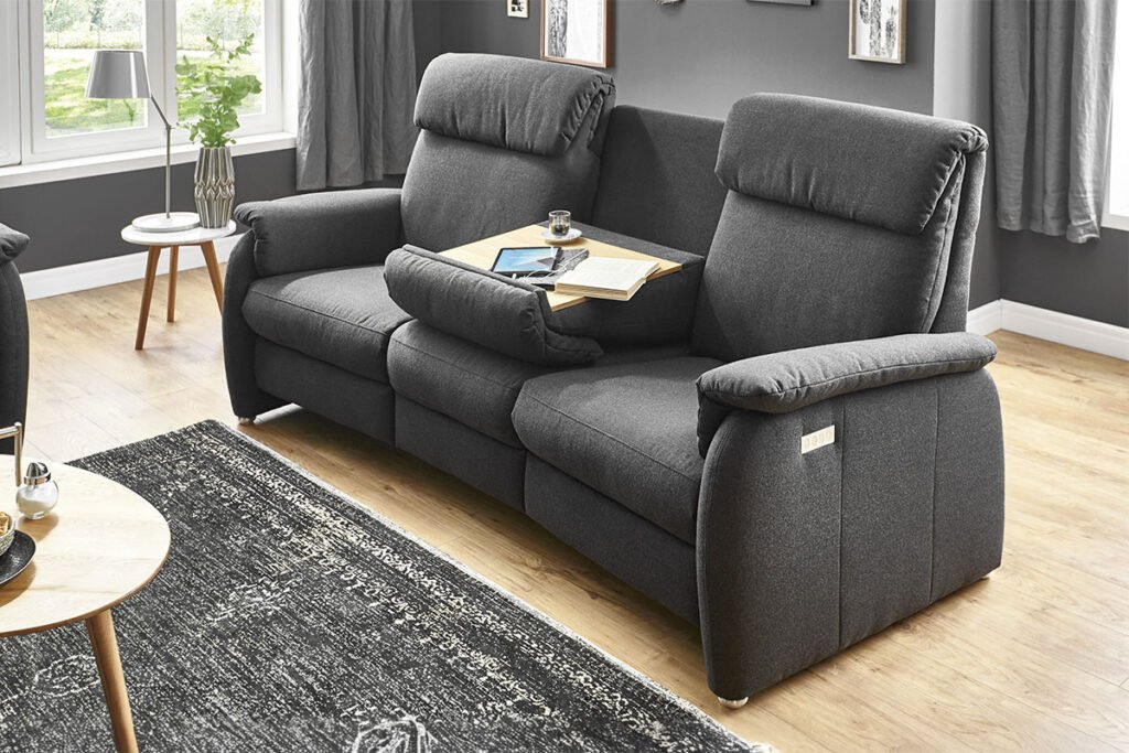 Trapezsofa, Bezug Stoff Dunkelgrau mit klappbarem Tisch